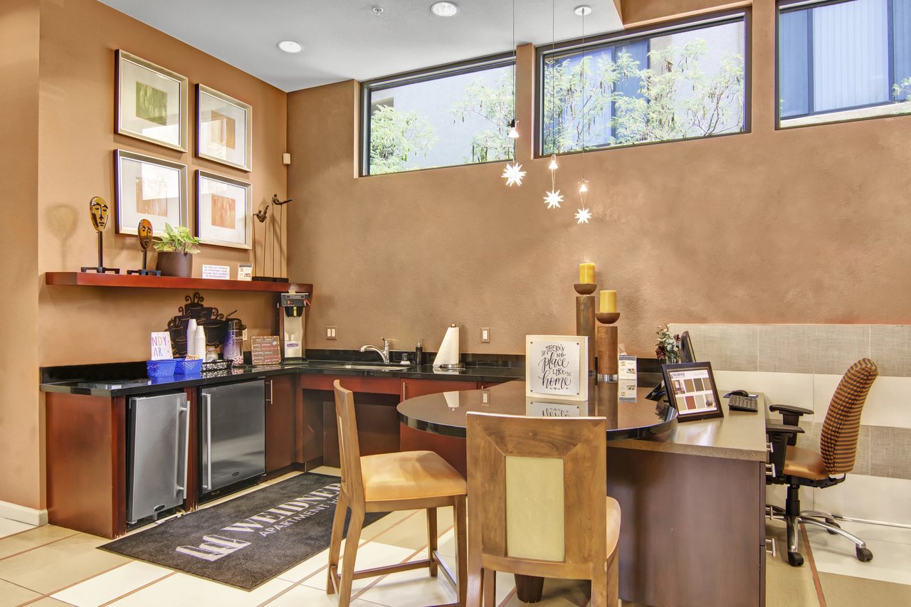 Community coffee bar with seating and decorative elements.