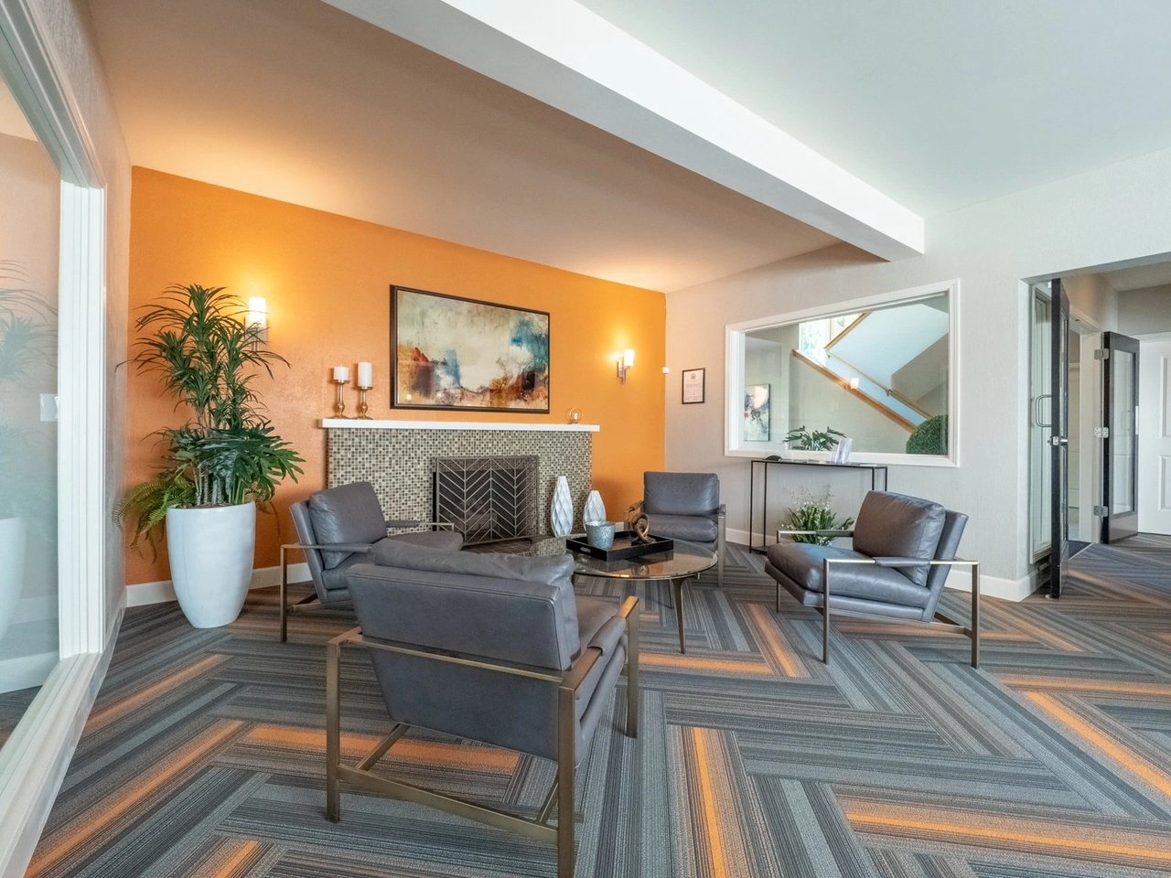 Community lounge area with fireplace and modern seating.