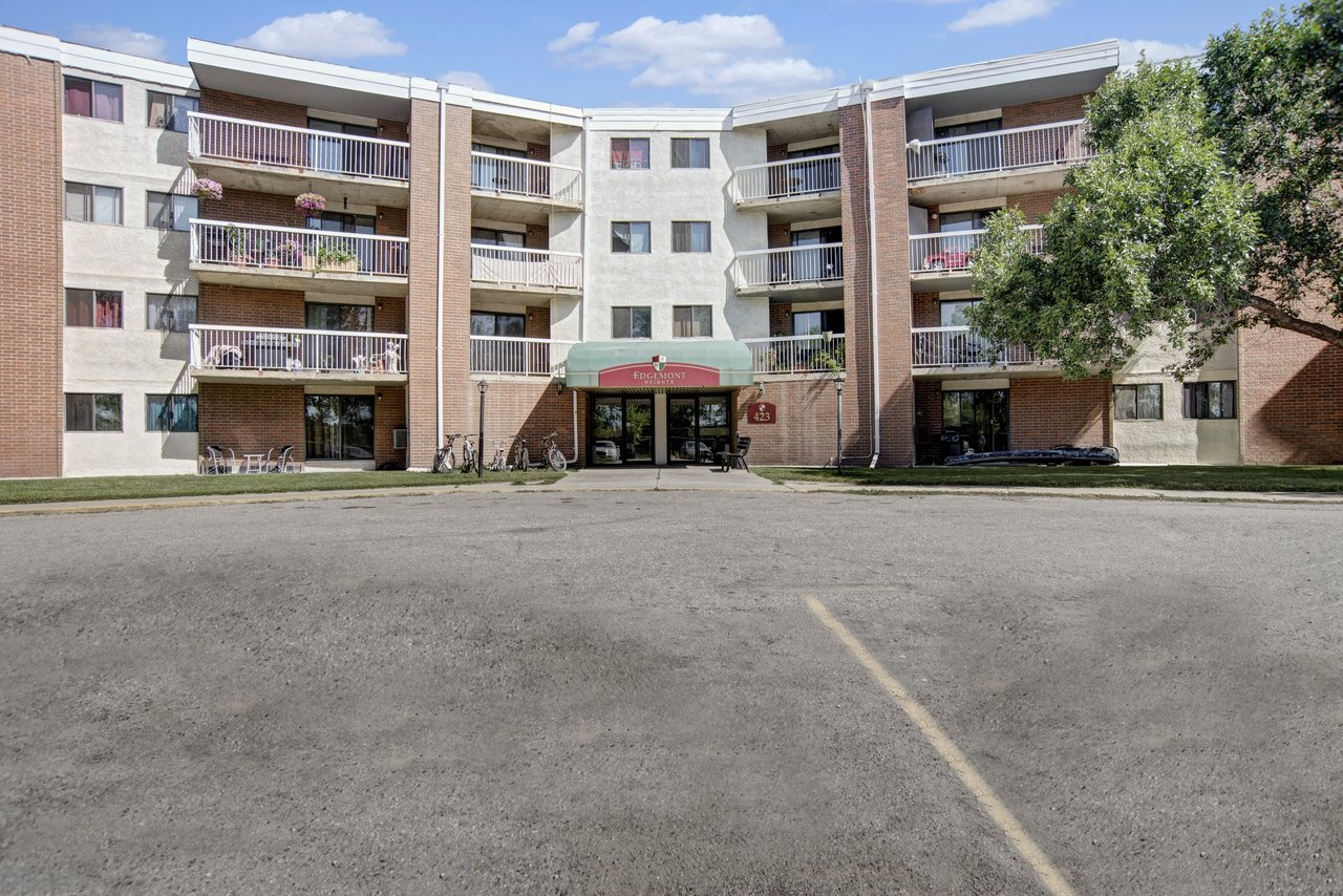Exterior view of Edgemont apartment building entrance and balconies.