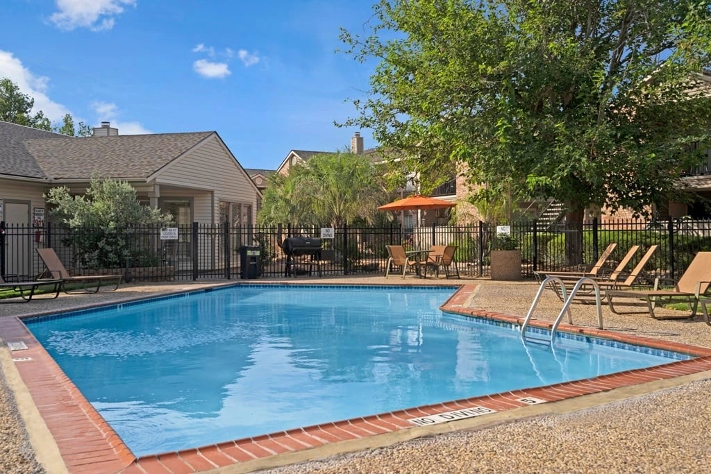 Swimming pool with lounge chairs and picnic area