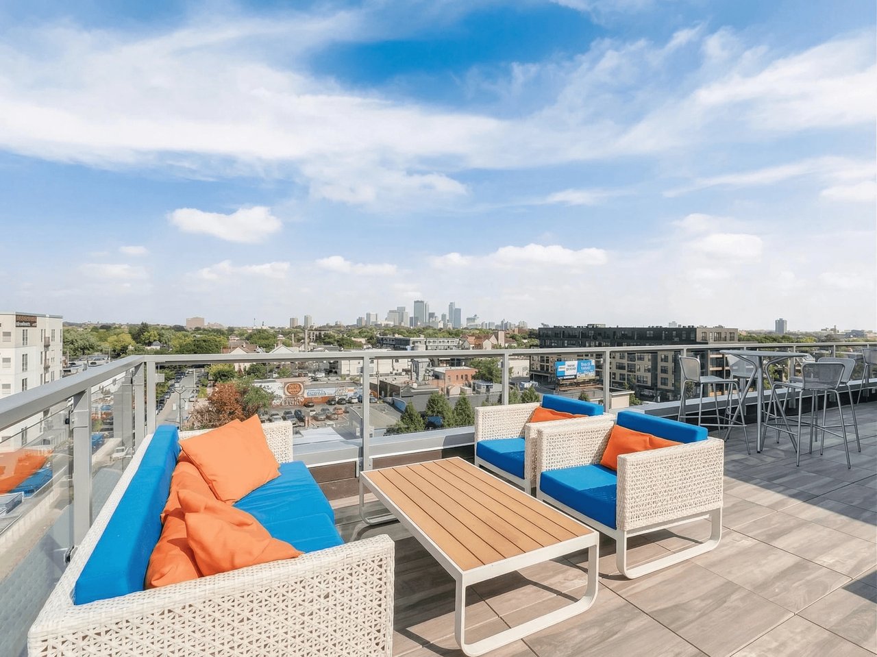 Rooftop patio seating area with city skyline view
