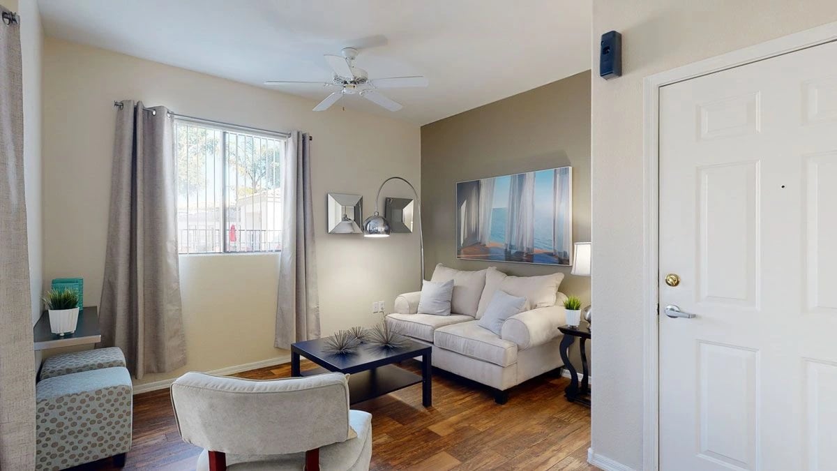 Living room with sofa, coffee table, and window.