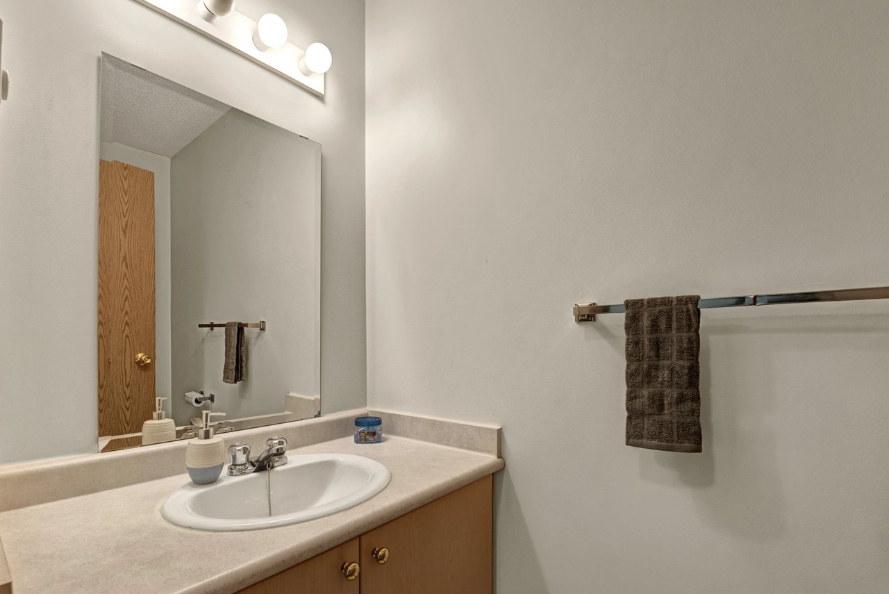 Bathroom with sink, vanity, and mirror.