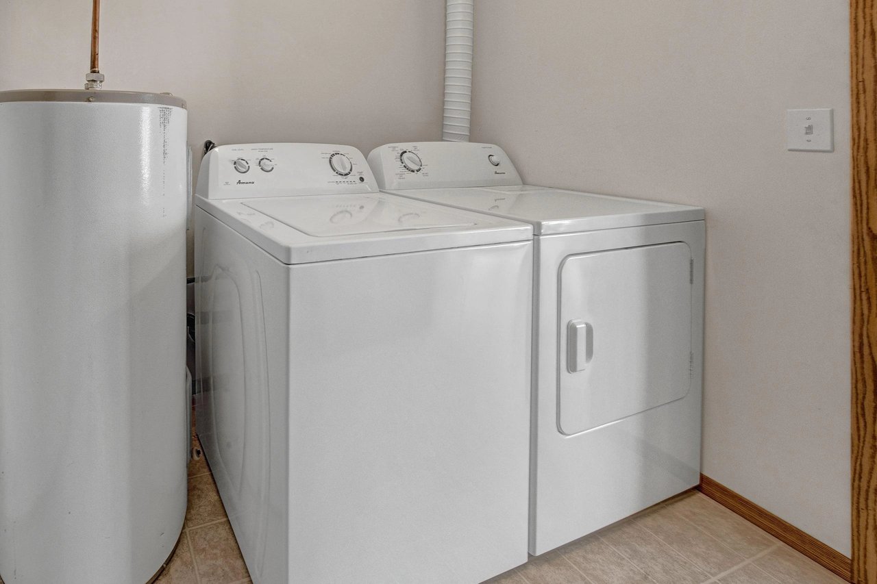 Washer and dryer with a water heater.