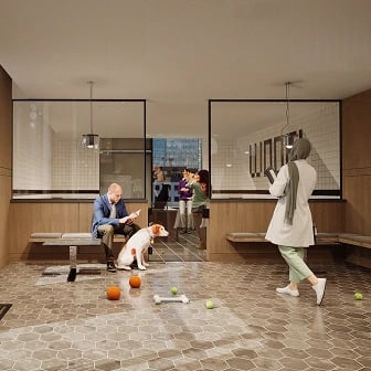 Man sitting on bench with dog in pet-friendly lounge.