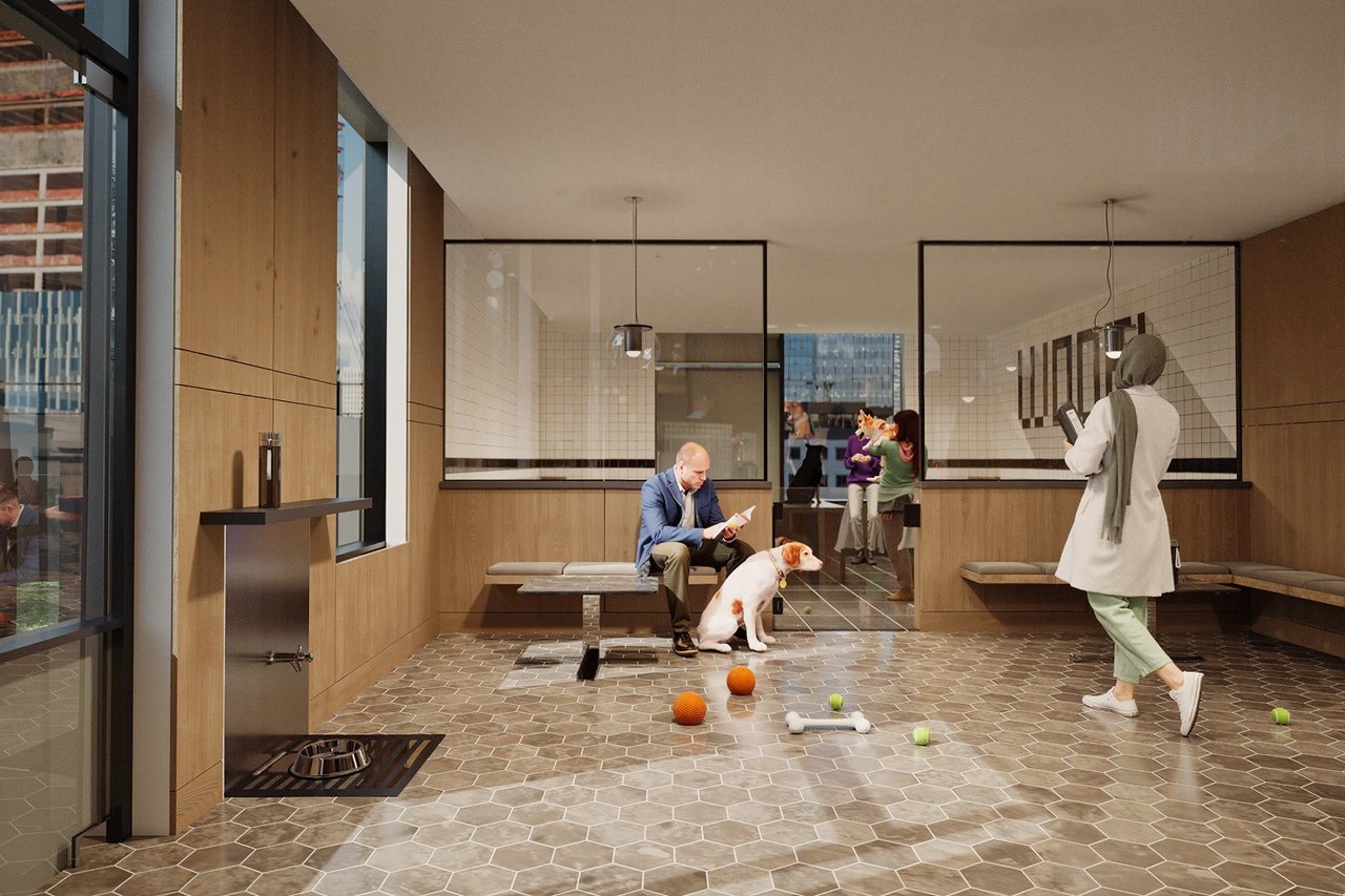 Interior of a modern pet spa with people and dogs interacting.
