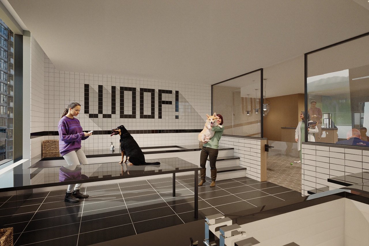 People and dogs in a modern pet grooming facility with 'WOOF!' sign.