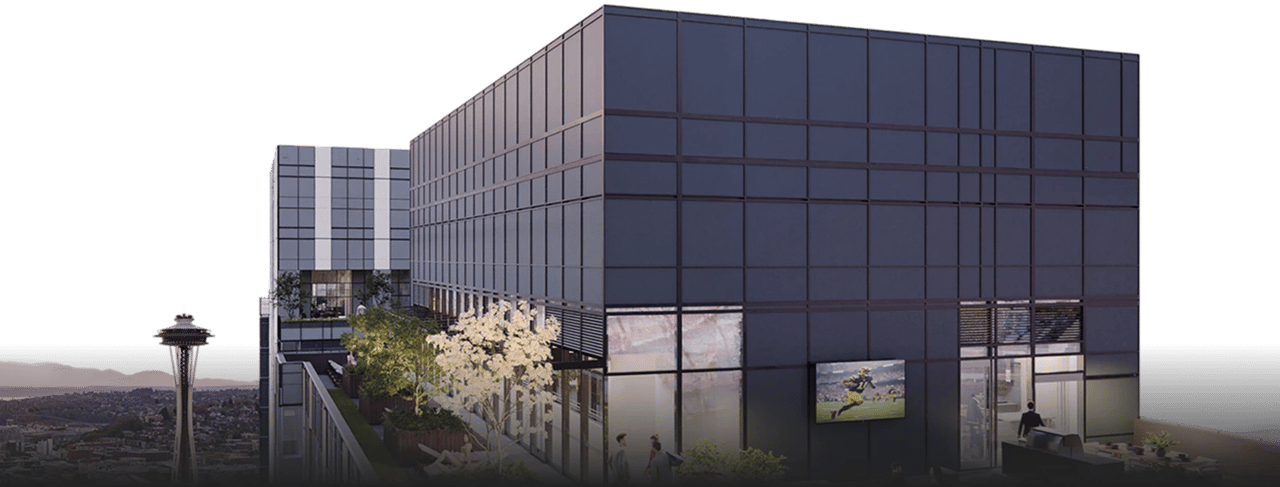 Modern apartment building exterior with city skyline and Space Needle view.