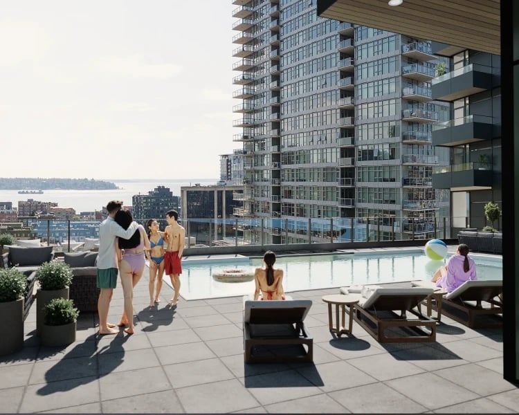 People enjoying a rooftop pool deck with a city view.