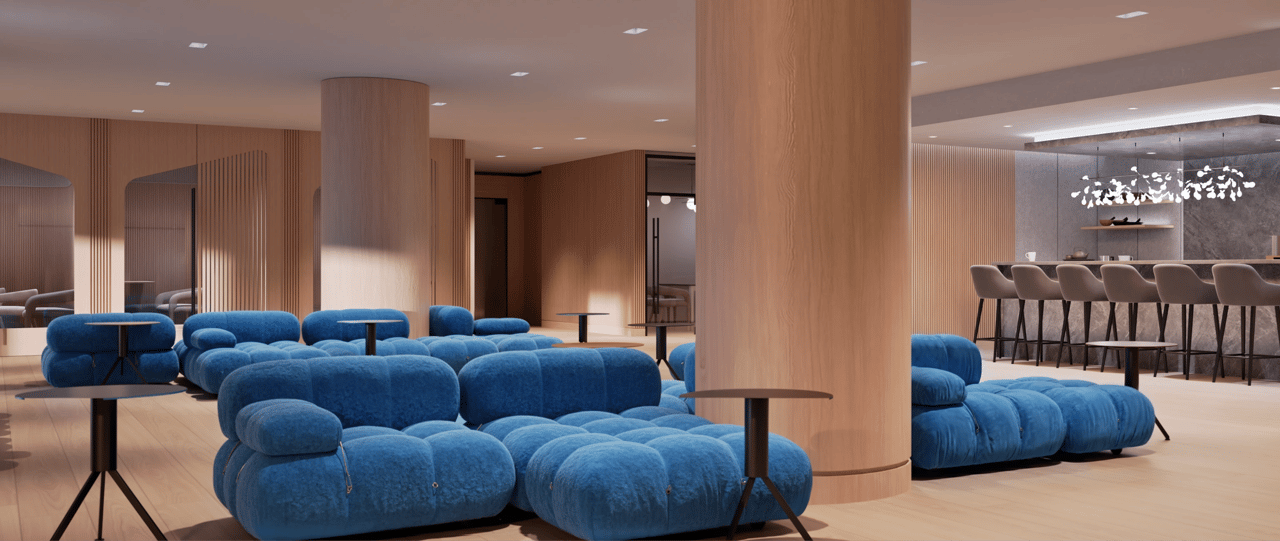 Modern lounge area with blue modular sofas and a bar.