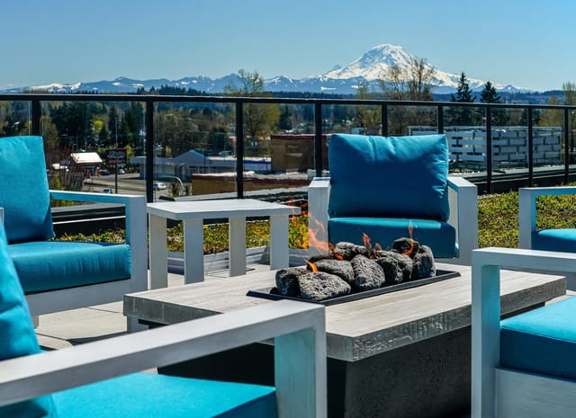 Outdoor seating area with fire pit and mountain view