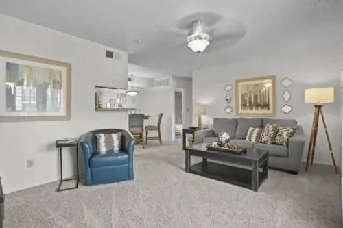 Living room with sofa, coffee table, and accent chair.