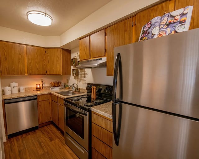 Kitchen with stainless steel appliances and wood cabinets