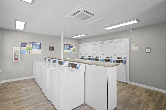 Laundry room with washers and dryers.