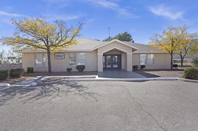 Community Resource Center building exterior with double blue doors and signage.