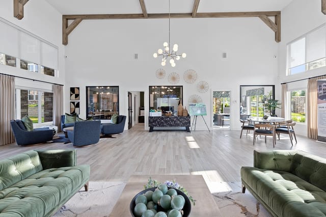 Modern community lounge area with green seating and large windows