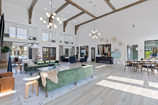 Bright and modern community lounge area with seating and decor.