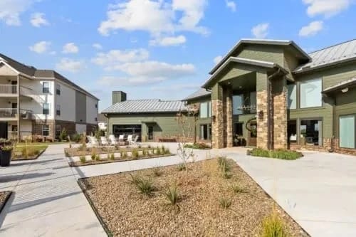 Exterior courtyard and building entrance of multifamily property