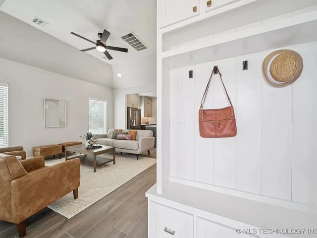 Spacious living area with modern furniture and decorative items