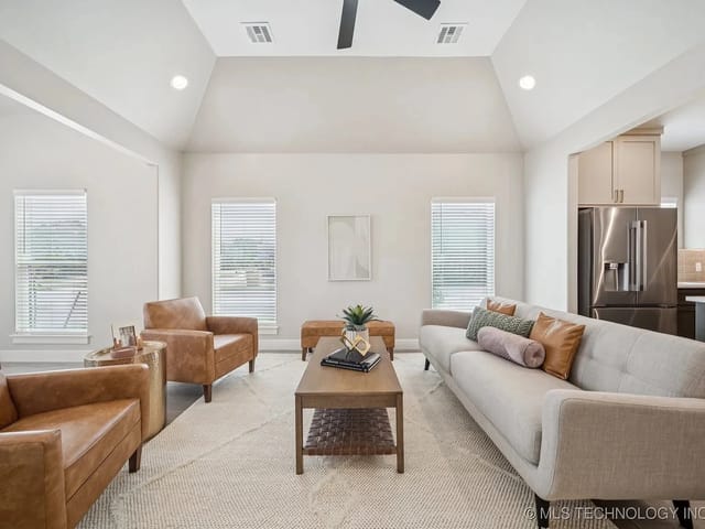 Modern living room with a couch and armchairs
