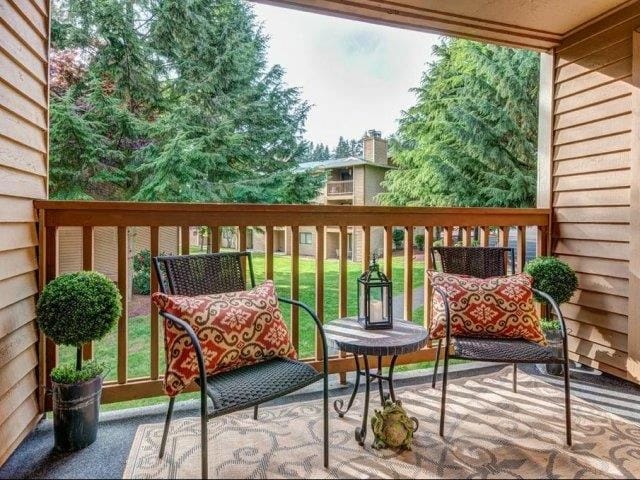 Balcony with seating area and trees