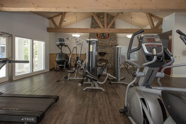 Fitness center with treadmills, elliptical, and weight machines.