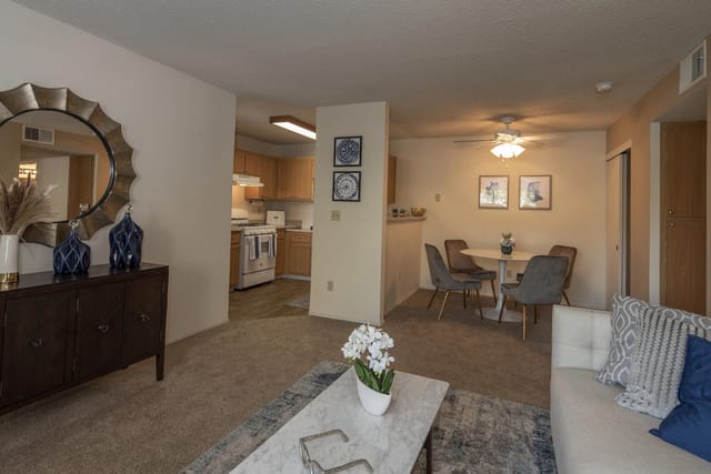 Living area with dining and kitchen views