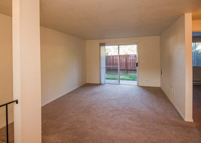 Spacious living room with sliding glass door to backyard
