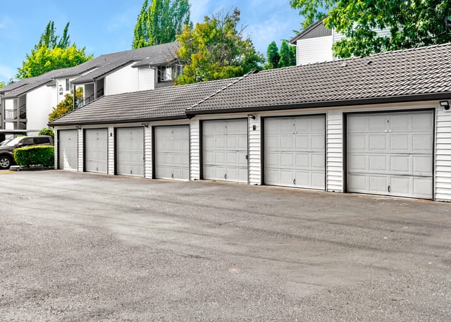 Exterior view of garage bays at a multifamily property.