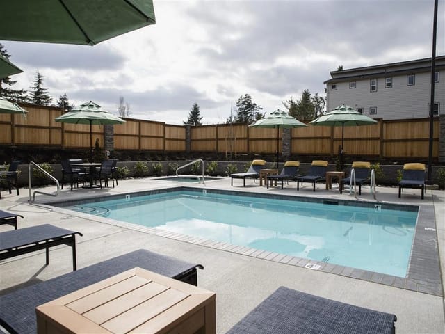 Swimming pool with lounge chairs and umbrellas