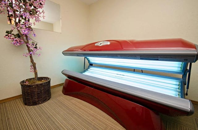 Red tanning bed with blue lights