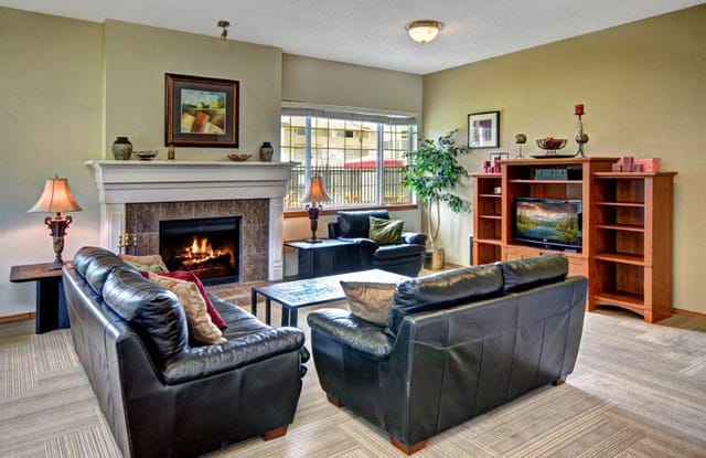 Living room with fireplace and seating areas