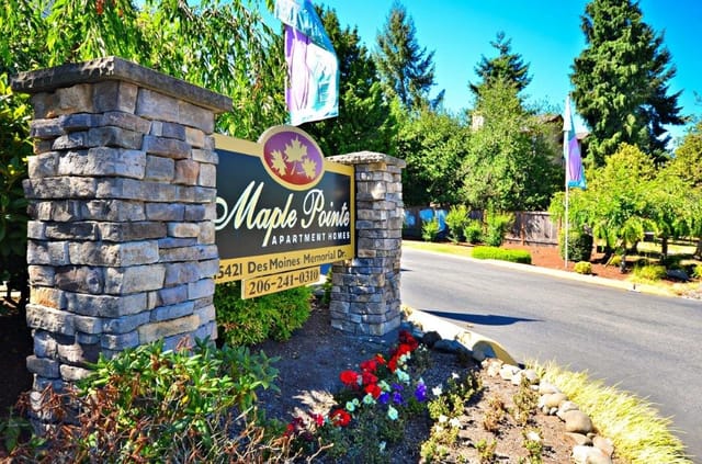 Maple Pointe Apartment Homes entrance monument sign with address and phone number.