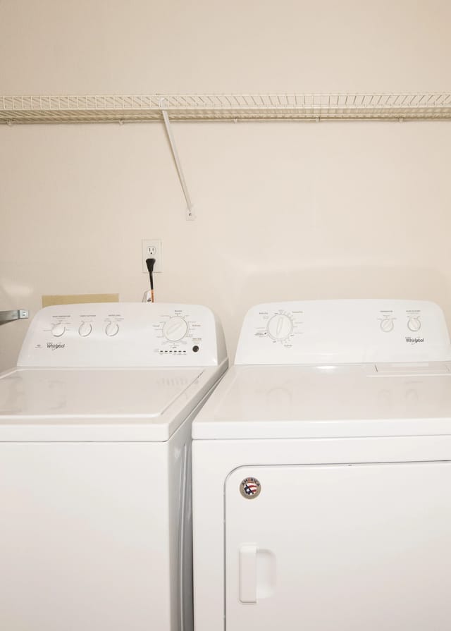 Washer and dryer machines in laundry room.
