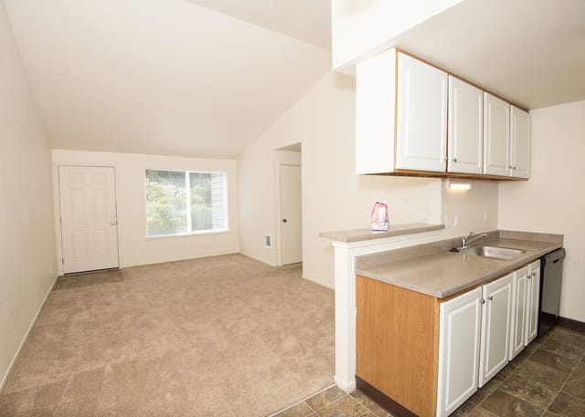 Open concept living area with kitchen island and view of living room.