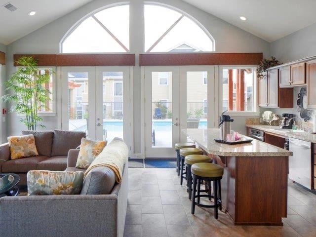 Living area with kitchen and pool view