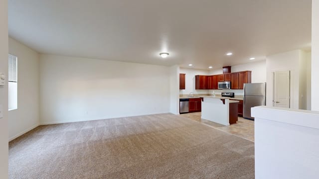 Spacious living room with kitchen view
