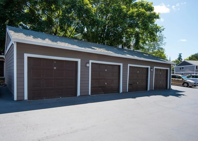 Row of garages with numbered doors.