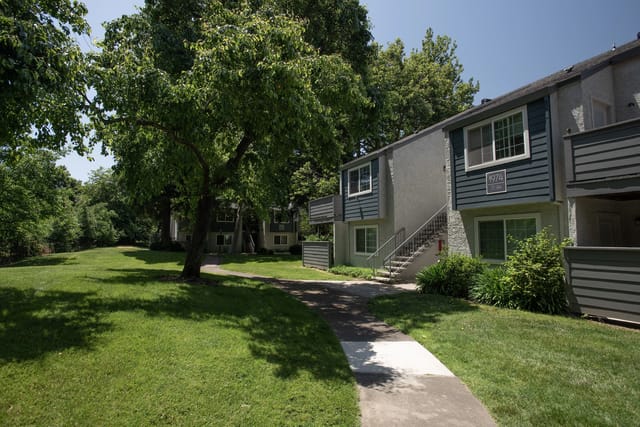 Exterior buildings and green lawn with a walkway