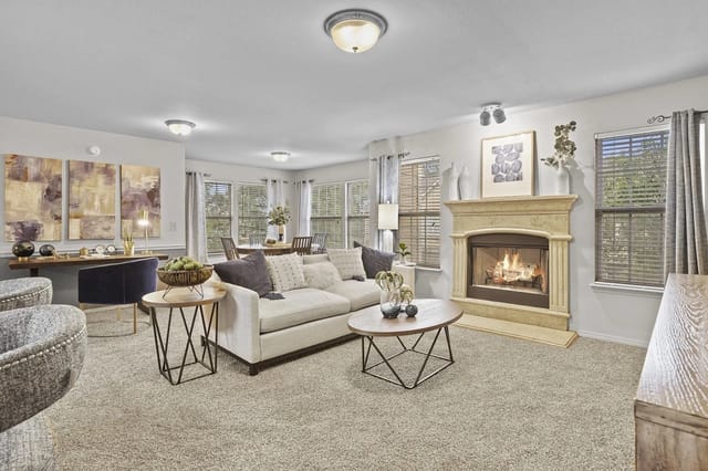 Spacious living room with a fireplace and large windows.