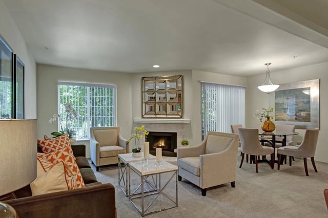 Living room with fireplace and dining area