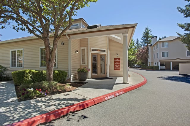 Building entrance with signage and landscaping