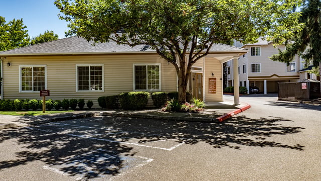 View of the property's main building entrance and signage.