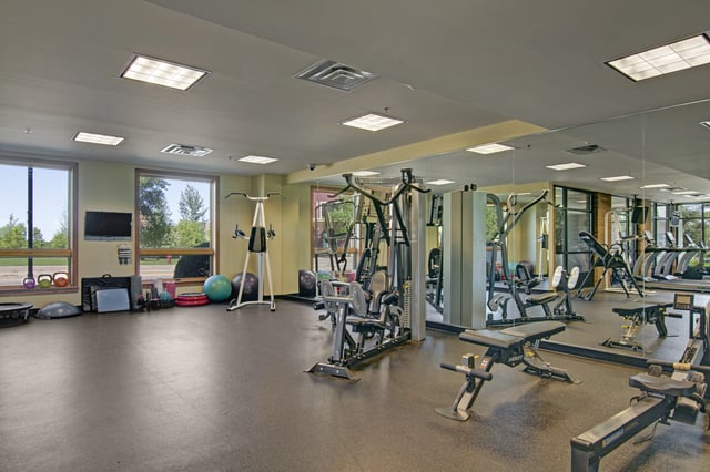Gym with cardio machines and weightlifting equipment