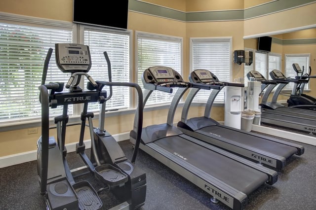 Gym with treadmills and elliptical machine.