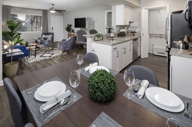 Dining area and kitchen of a multifamily property apartment.