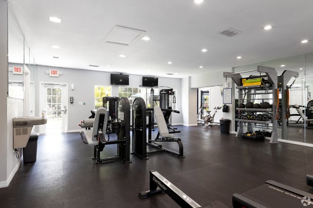 Fitness center with weight machines, cardio equipment, and free weights.
