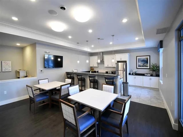 Community kitchen with seating and a bar area.