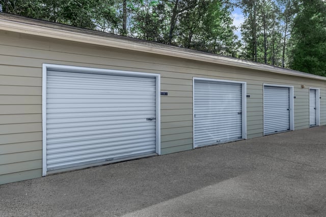 Row of garage doors for resident storage.