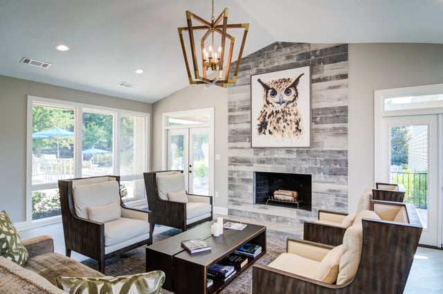 Lounge area with fireplace and owl painting
